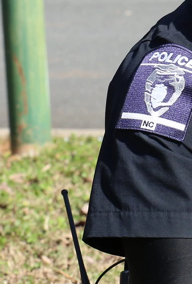 A photo of a police officer with a woman.